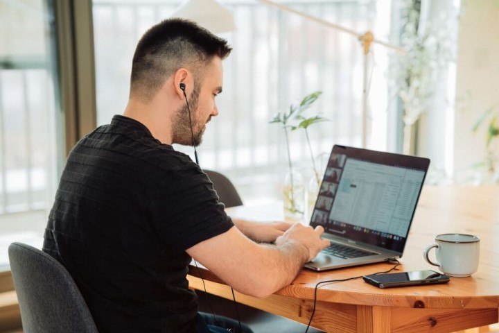 Man at a desk using a laptop