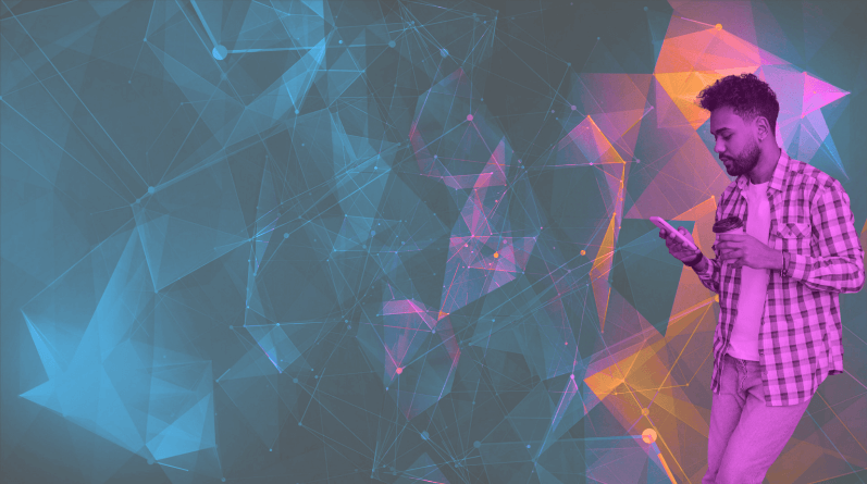 Man leaning on a wall looking at his phone (1)