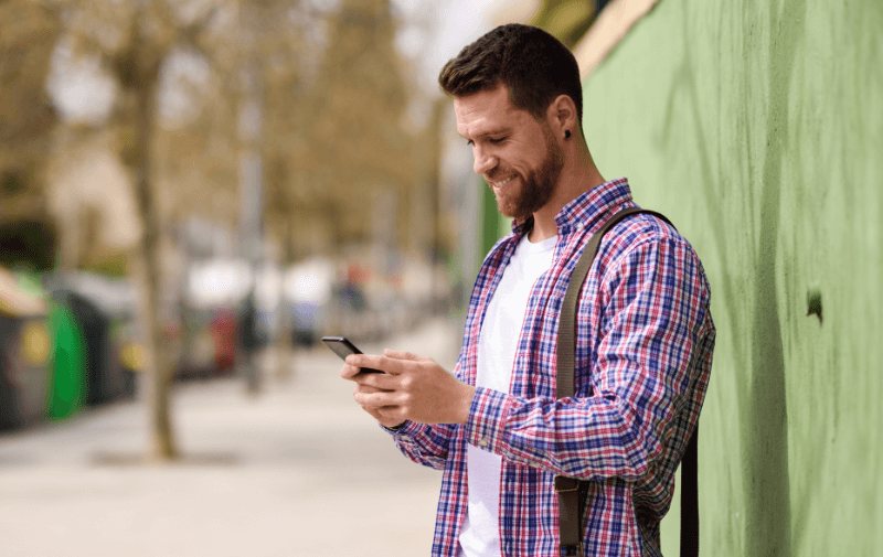 Man looking at his mobile phone (1)