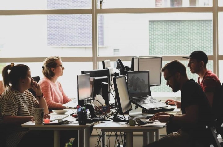 People in an office on computers